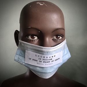 Close-up portrait of a teenage girl against wall