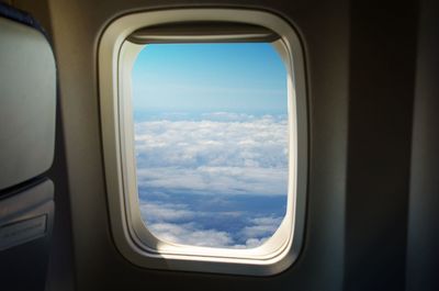 Airplane wing seen through window