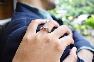 Close-up of couple holding hands