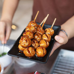 Close-up of hand holding food