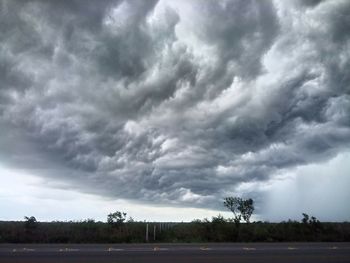 Storm clouds over field