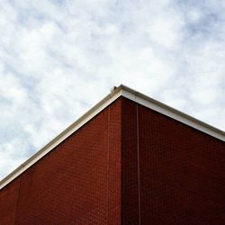 High section of building against cloudy sky