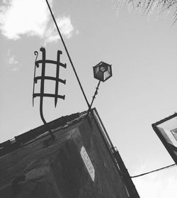 Low angle view of street light against sky