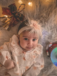 Portrait of woman holding christmas decoration