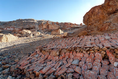 Low angle view of rock formations against sky