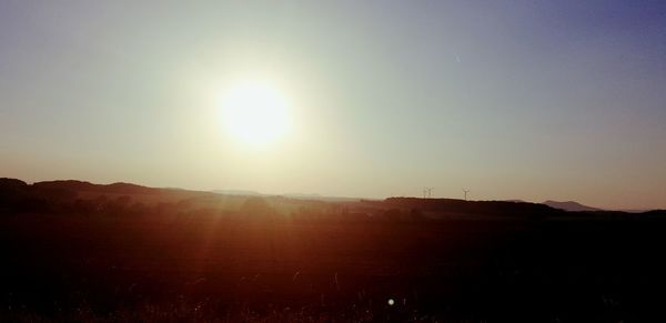 Scenic view of landscape against sky during sunset