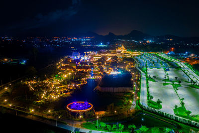 High angle view of illuminated buildings in city at night