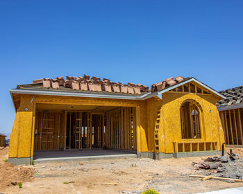 Low angle view of building against clear blue sky