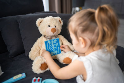 Girl with teddy bear