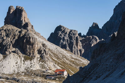 Mountain cabin and mountain side in shadow