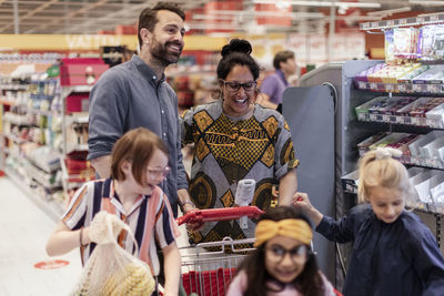 Family doing shopping in supermarket