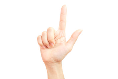 Close-up of human hand over white background