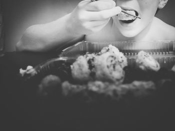 Midsection of woman holding ice cream in plate