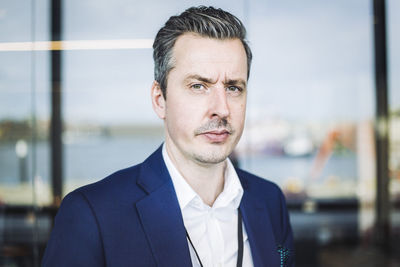 Portrait of male entrepreneur standing in office