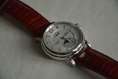 High angle view of clock on table