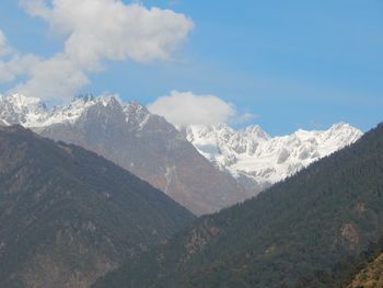 Scenic view of snowcapped mountains against sky