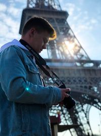 Man looking at camera against sky