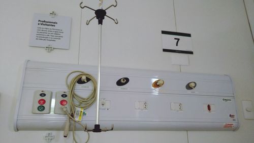 Low angle view of lighting equipment on wall