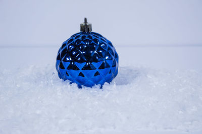 Close-up of christmas decoration in snow