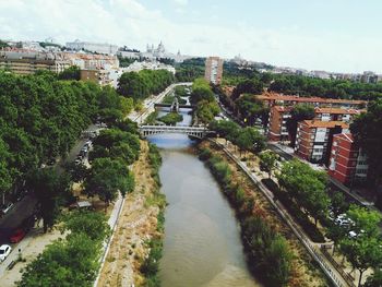 High angle view of river amidst buildings in city