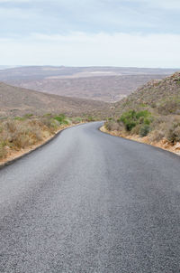 Road amidst landscape against sky