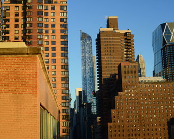 Modern buildings against clear sky