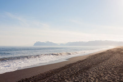 Scenic view of beach against sky during sunset