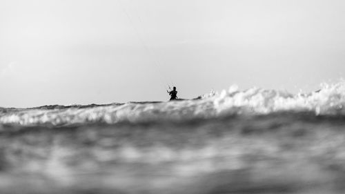 People on sea against sky