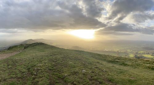 Scenic view of landscape against sky during sunset