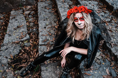 Closeup portrait of calavera catrina. young woman with sugar skull makeup. dia de los muertos. day