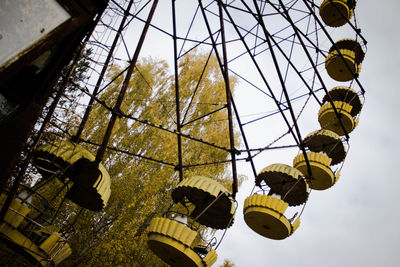 Low angle view of ferris wheel against sky