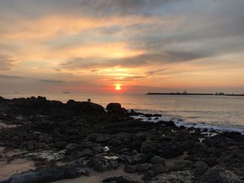 Scenic view of sea against sky during sunset