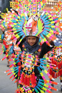 Portrait of girl with multi colored umbrella