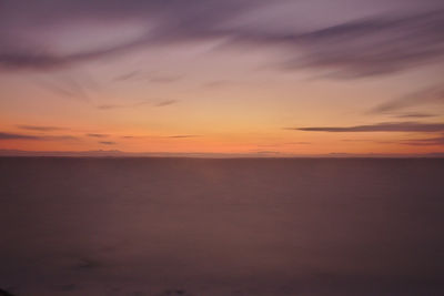 Scenic view of sea against sky at sunset
