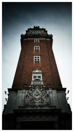 Low angle view of bell tower against sky