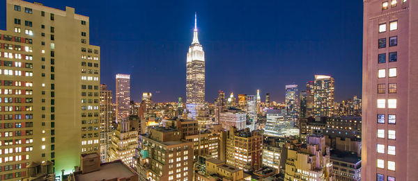 Illuminated buildings in city at night