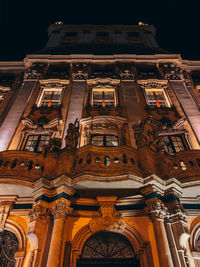 Low angle view of illuminated building at night