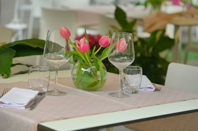 Flower vase on table in restaurant