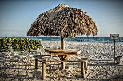 Silhouette of chairs on beach