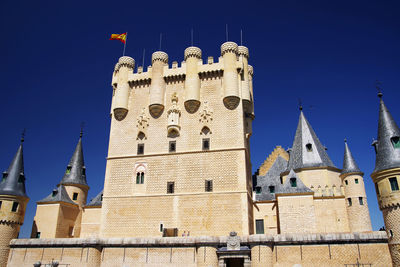 Low angle view of building against blue sky