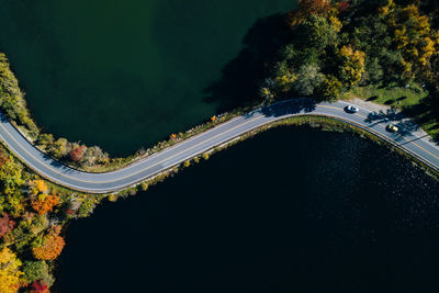 High angle view of road amidst trees in city