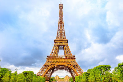 Low angle view of tower against cloudy sky