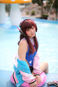 Portrait of young woman in swimming pool