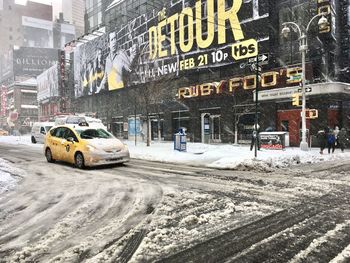 Cars on snow in city