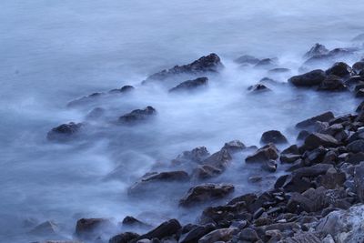 Scenic view of rocks in sea