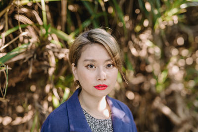 Portrait of young woman outdoors