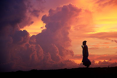 Silhouette of people at sunset