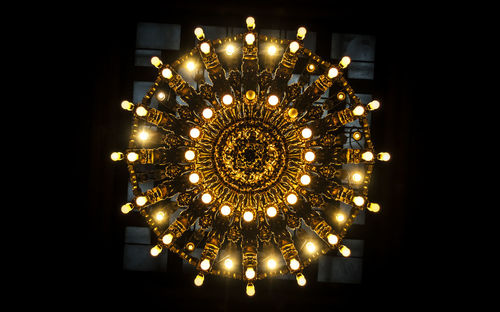 Low angle view of illuminated chandelier