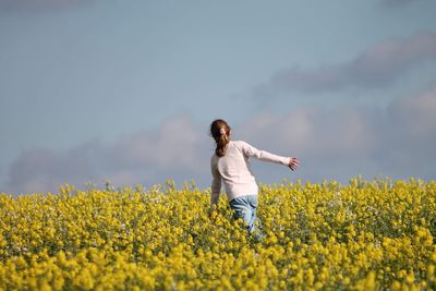 Full length of man standing on field