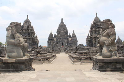 Statue of historic building against sky